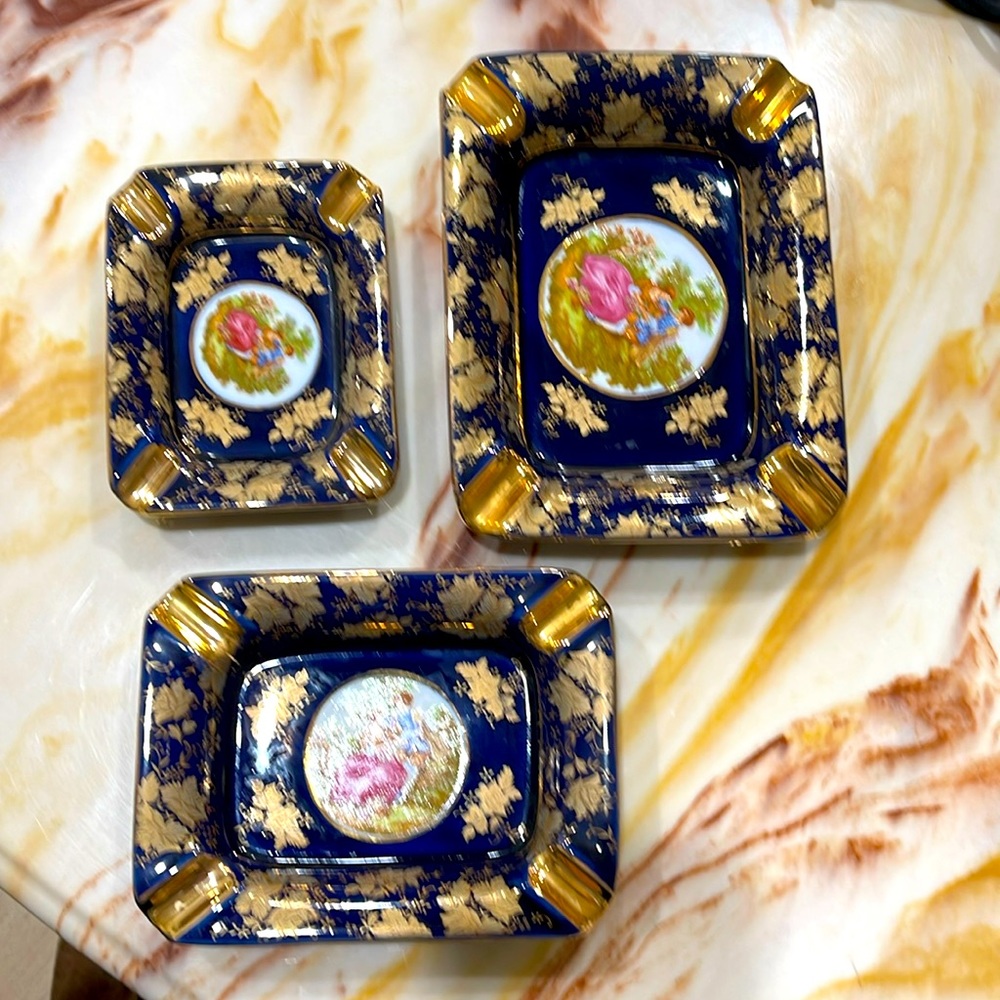 Ashtrays . Designed in Italy . Gorgeous blue with gold. Priced each .